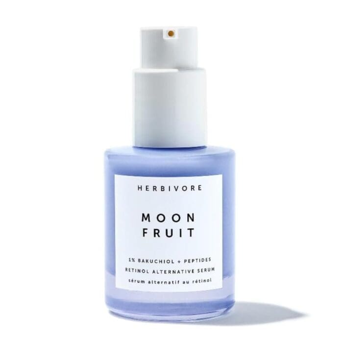 A standalone product image of Herbivore Botanicals' Moon Fruit Retinol Alternative Serum. The serum is contained in a pastel purple glass bottle with a white pump dispenser. The label clearly displays the product name and highlights key ingredients, including 1% Bakuchiol + Peptides as a plant-based retinol alternative.