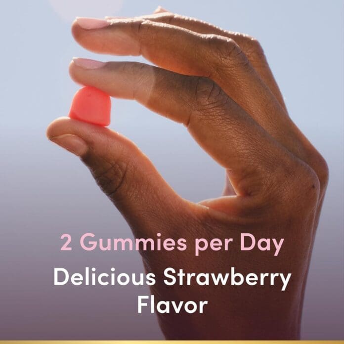 A hand holding a single red gummy with text highlighting that the recommended serving is two gummies per day, featuring a delicious strawberry flavor.