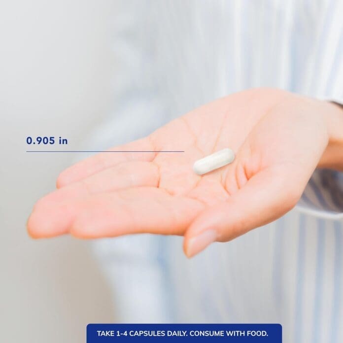 A close-up of a hand holding a single Pure Encapsulations Magnesium Glycinate capsule, measuring 0.905 inches in length, with dosage instructions recommending 1-4 capsules daily with food.